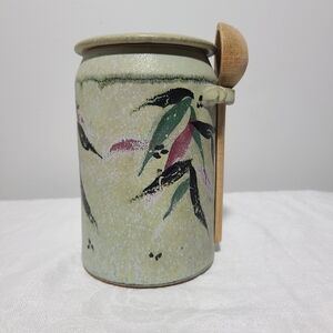 Rustic ceramic jam jar with spoon